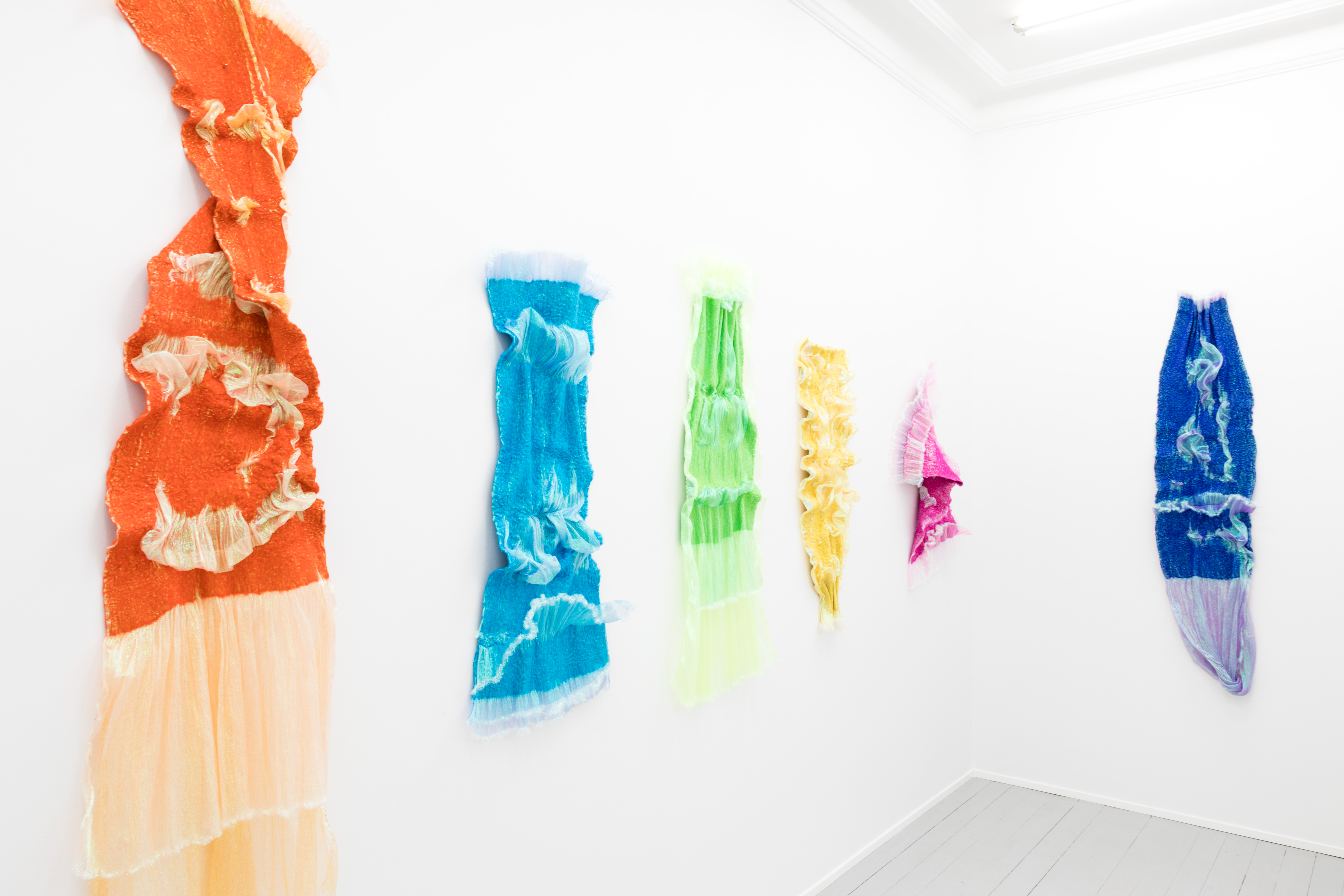 Rookie's Rave #2 Orange, 2018, Merino wool, polyester organza, 190 x 60 x 15 cm; Rookie's Rave #5 Turquoise, 2018, Merino wool, polyester organza, 120 x 55 x 10 cm;Rookie's Rave #4 Green, 2018, Merino wool, polyester organza, 140 x 75 x 8 cm; Rookie's Rave #3 Yellow, 2018, Merino wool, polyester organza, 110 x 45 x 8 cm; Rookie's Rave #8 Pink, 2018, Merino wool, polyester organza, 100 x 80 x 20 cm